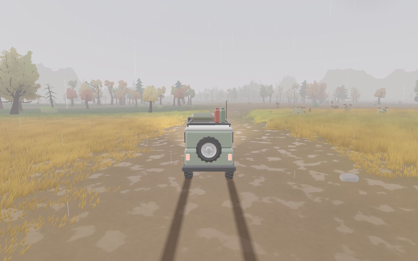 Rain on the valley: wet dark ground, grey sky and a truck with its lights on.